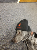 Red Summit Swag, Red Summit Beanie, Red Summit logo in red embroidered on soft knit black beanie. Shown on Red Summit mascot, our shop dog 'Summit'.